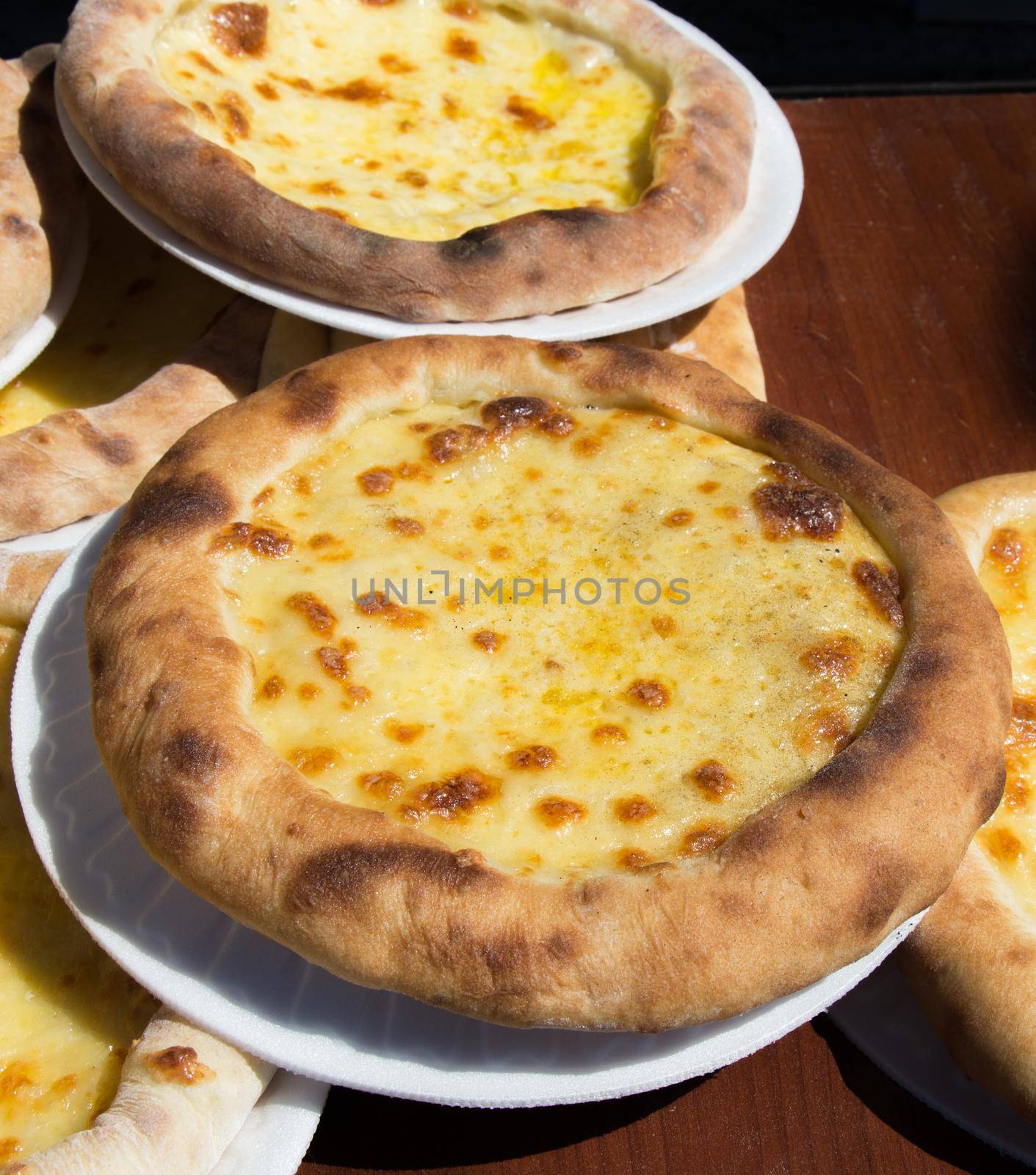 Turkish flat bread covered with cheese by berkay