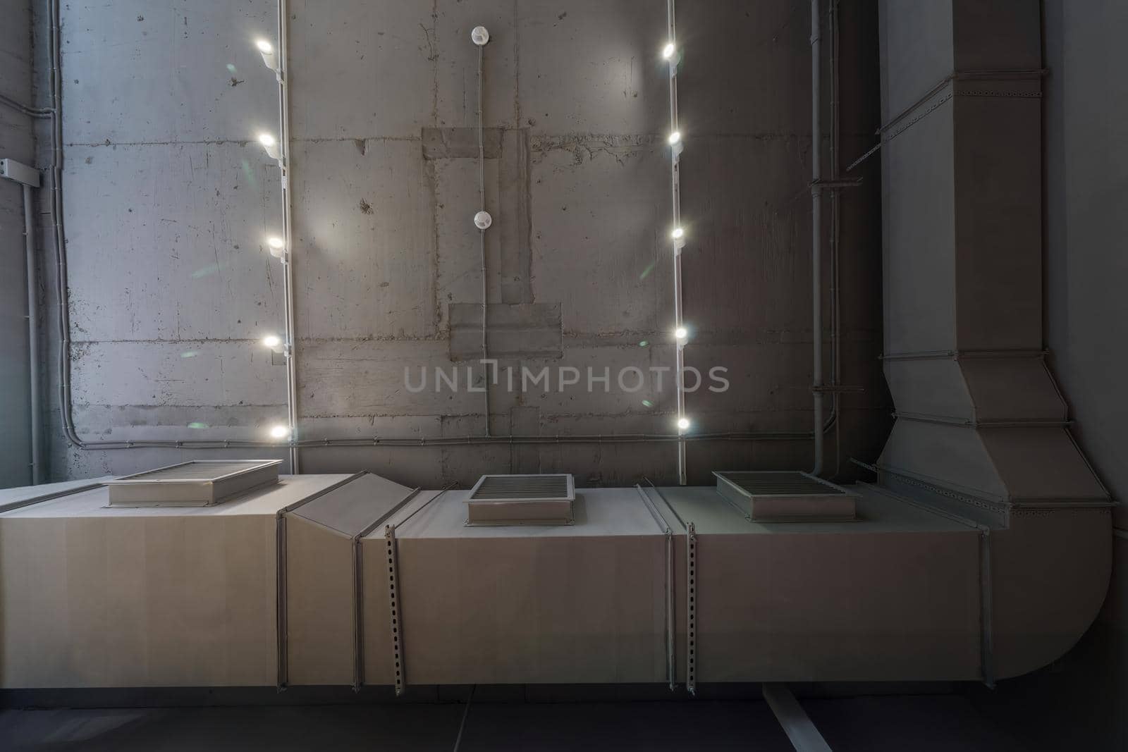 Abstract loft interior of concrete grey ceiling with air ventilation and security camera. Interior architecture and ceiling design of industrial loft building decorated with modern lamps by panophotograph