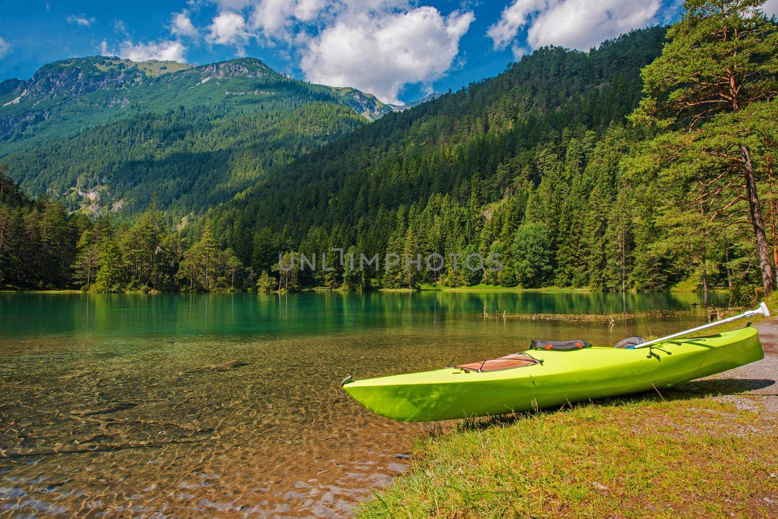 Scenic Bavarian Lake Kayaking During Summer Season. Turquoise Lake Water and Alpine Scenery.