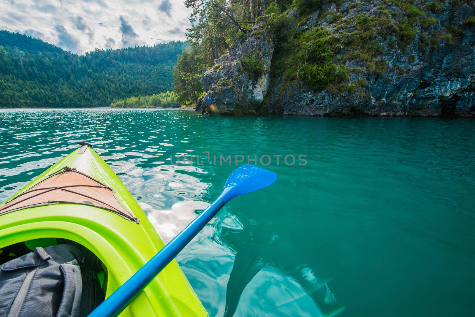 Turquoise Mountain Lake Kayaking Water Sports and Recreation. Summer Time Activity.