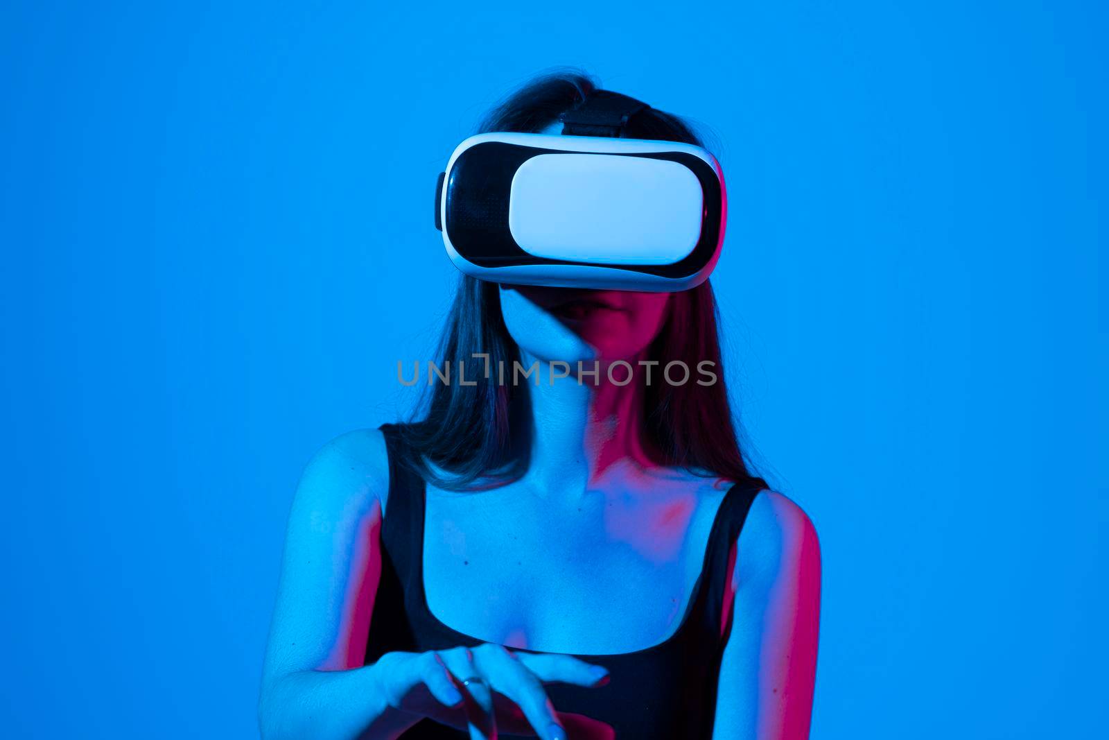 Female engineer wearing virtual reality headset designing a new pruducts or technologis using VR technology. Development and prototyping software. by vovsht