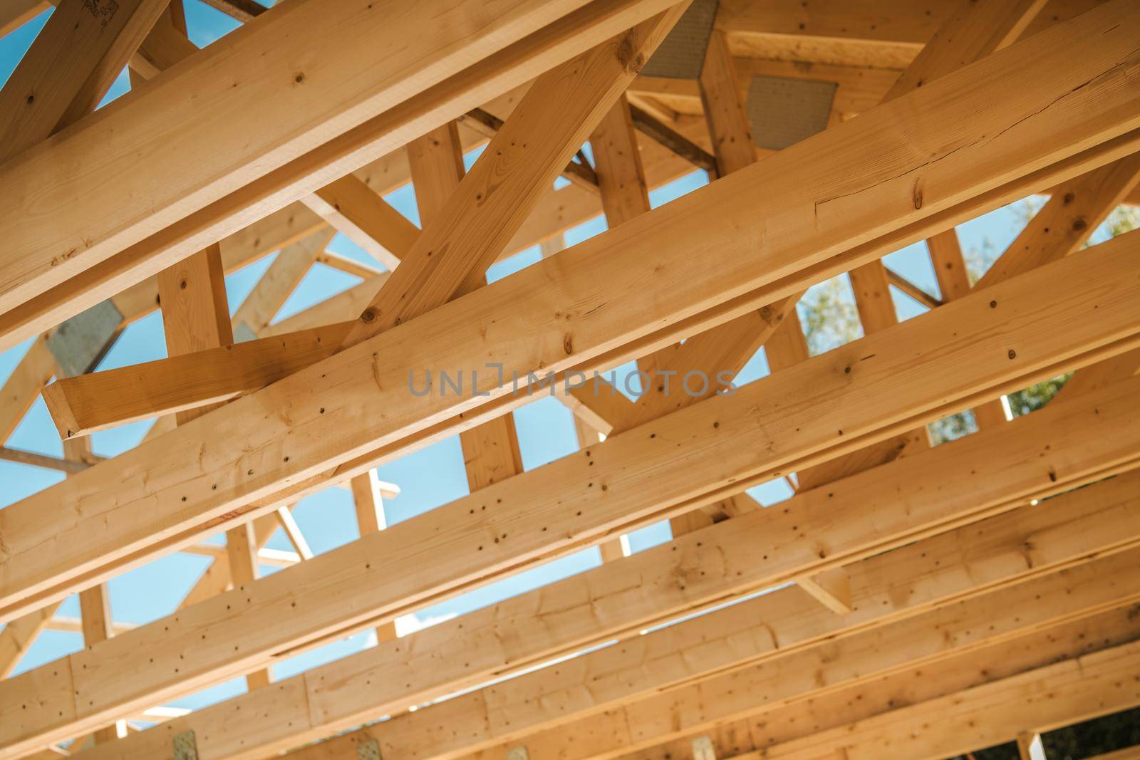 Wooden Roof Construction Beams Closeup Photo. Construction Industry Theme. 