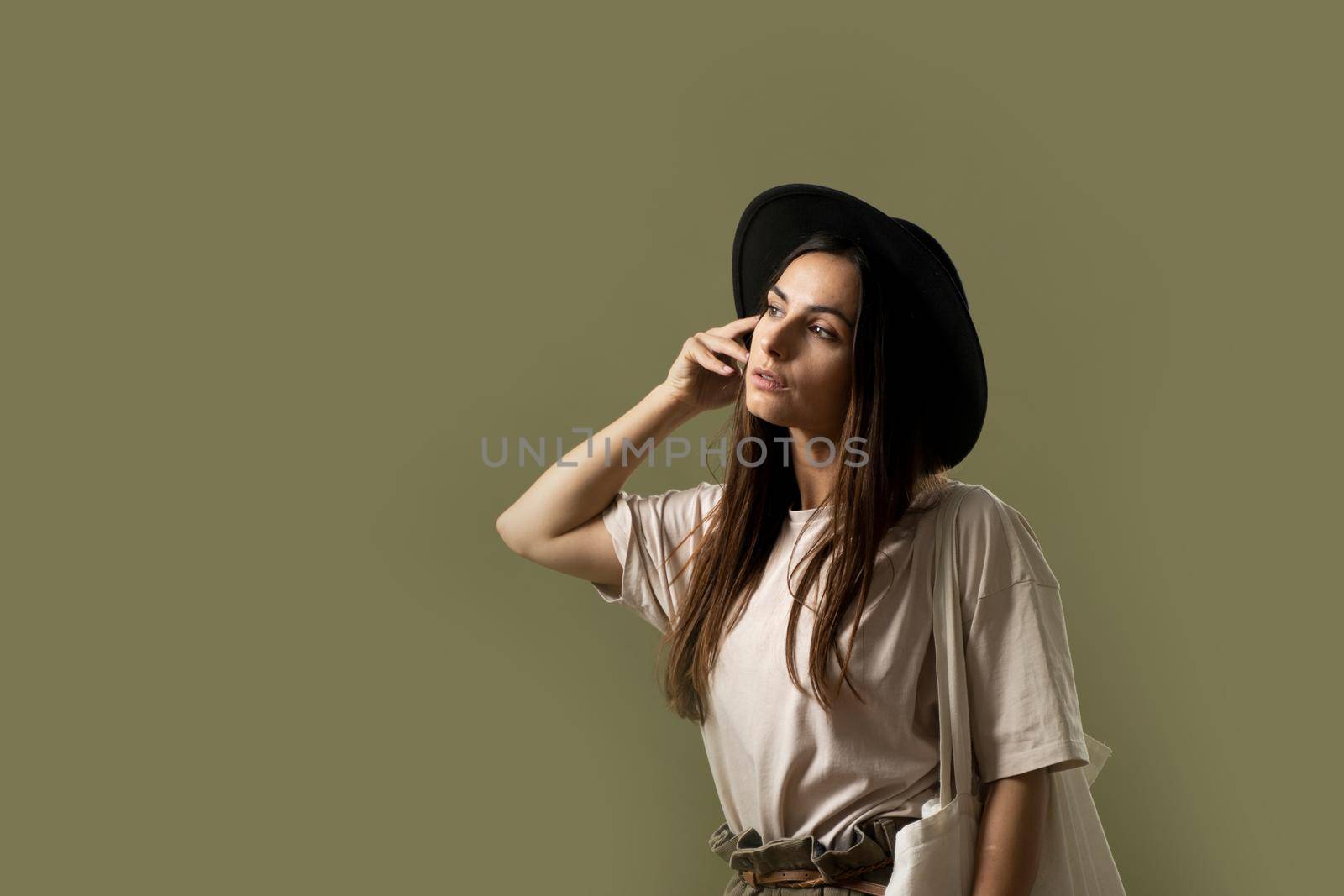 Ecology Concept. Woman holding cotton grocery bag with vegetables. Reusable eco bag for shopping. Zero waste concept. Eco friendly lifestyle. Isolated white background