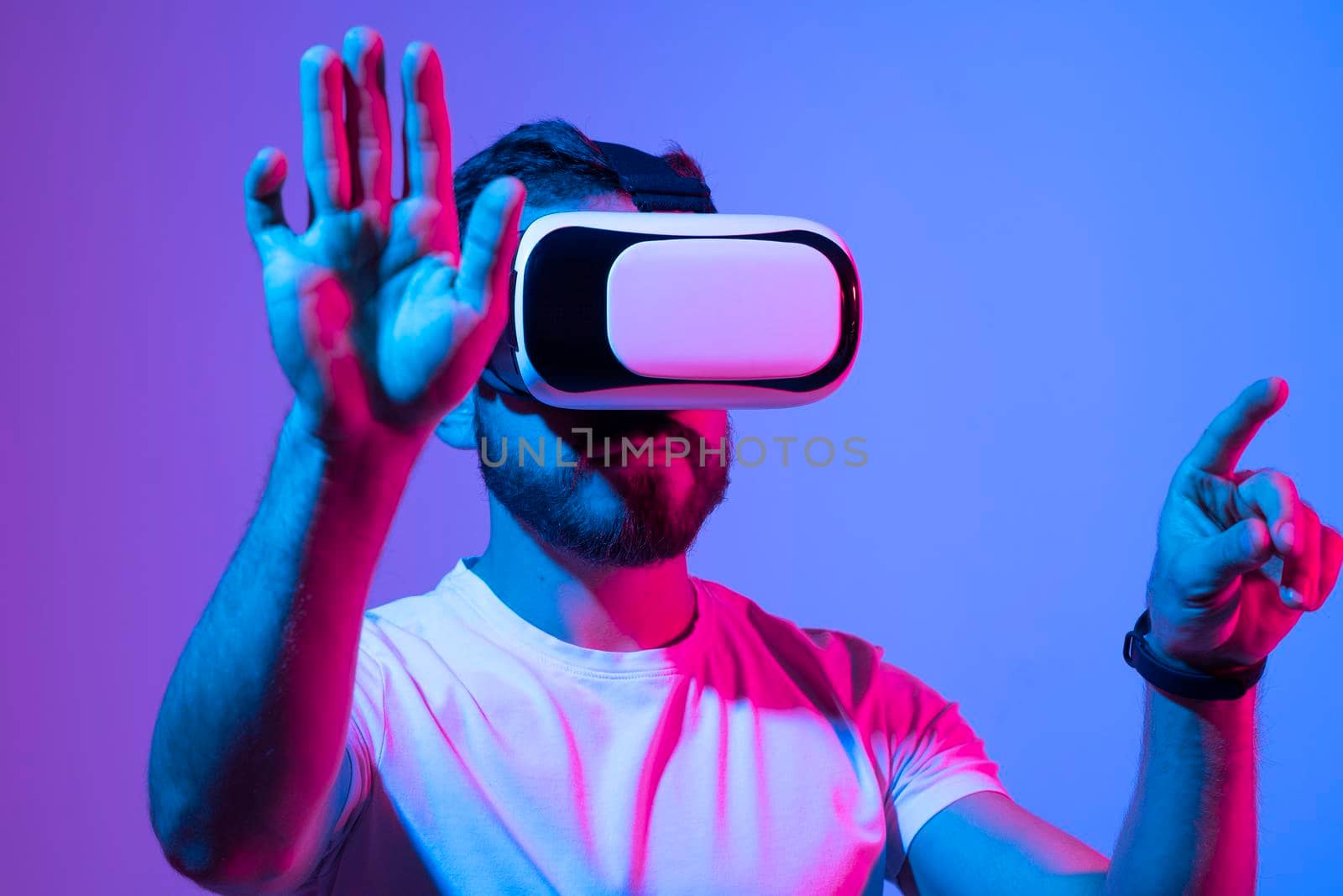 Man wearing virtual reality goggles. VR technology concept. Augmented reality, future technology concept. VR. Neon light