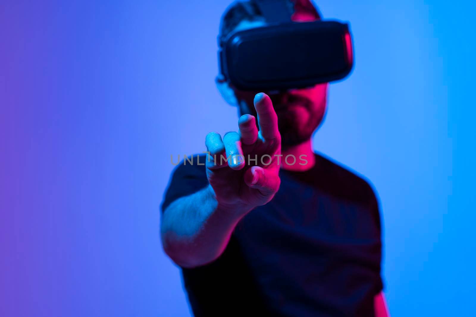 Future Technology and Business Concept. The man with glasses of virtual reality touching something in a virtual space