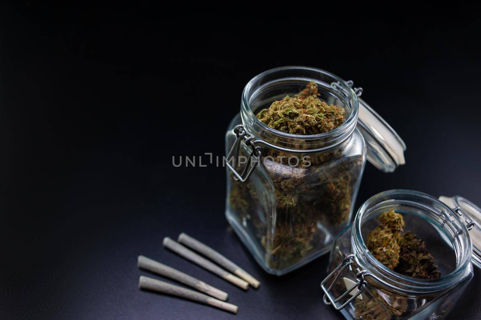 Dry marijuana in a jar and jamb