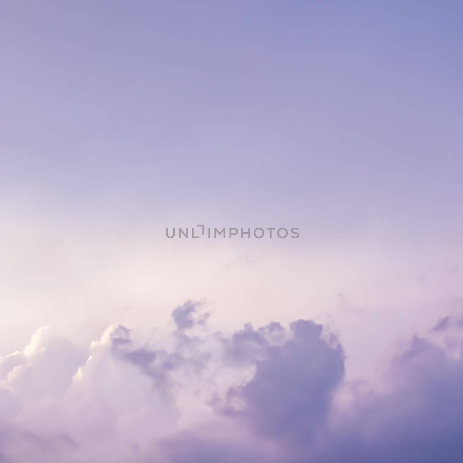 Background of a beautiful pink and pale purple sky with clouds at sunset. High quality photo