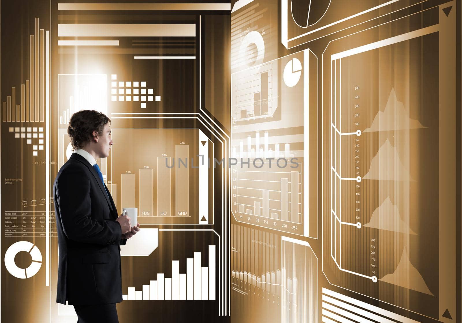 Businessman with mug in hands looking thoughtfully at media virtual screen