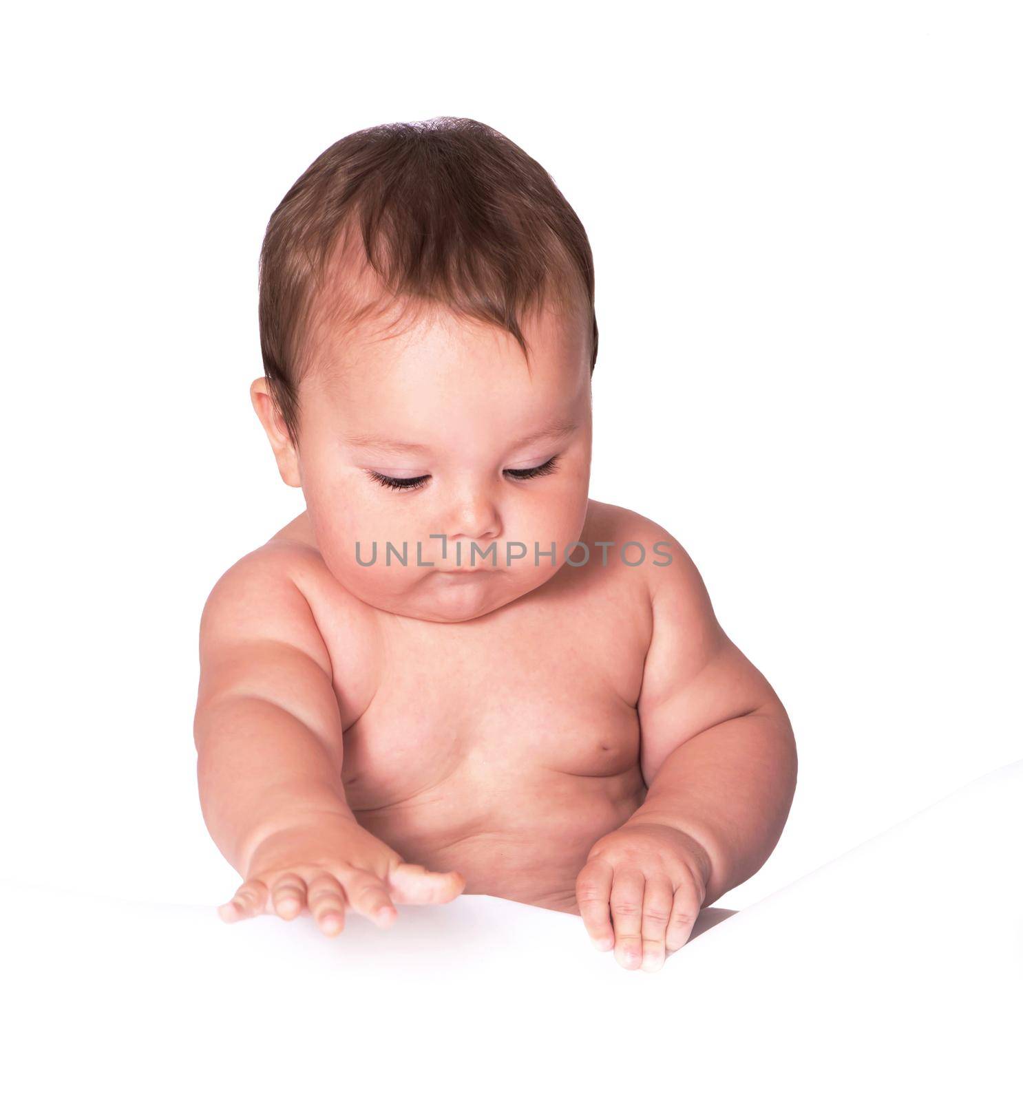 Little baby boy lying on the bed on white background by aprilphoto