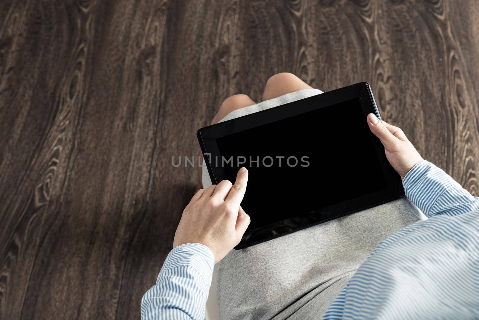 close-up of female hands with a computer tablet