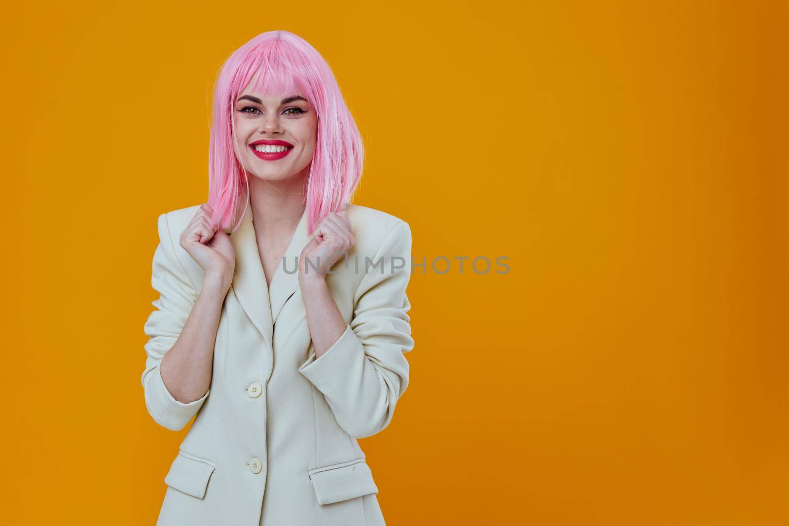 pretty woman white jacket pink hair yellow background. High quality photo