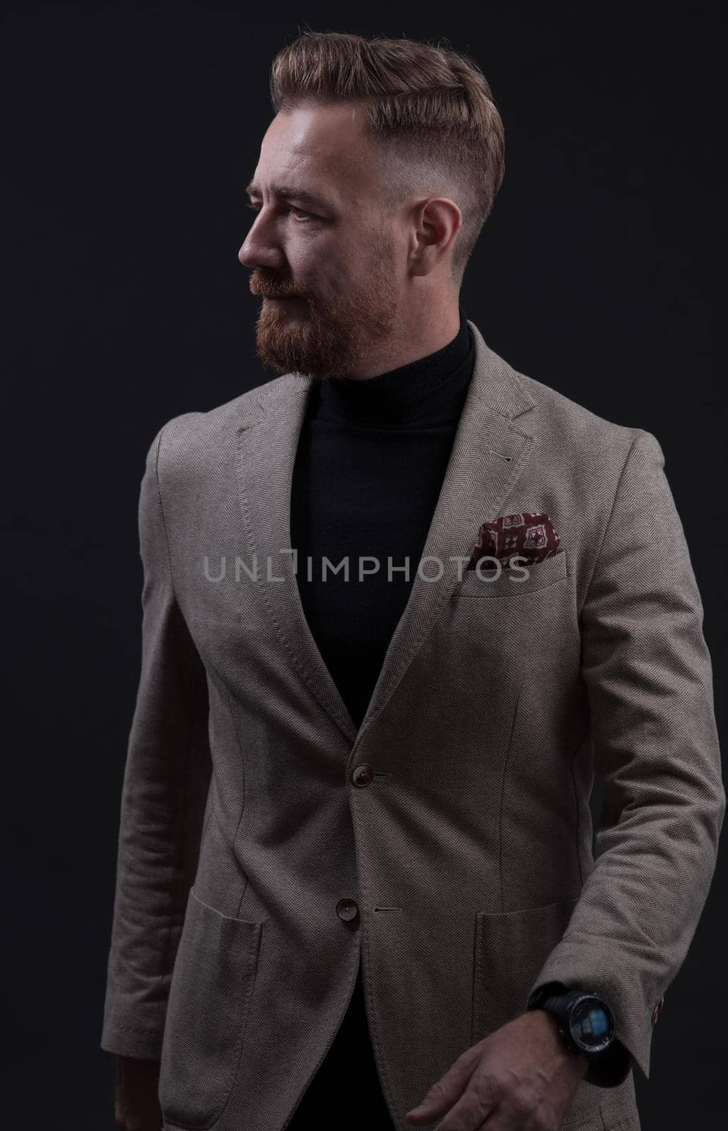 Confident businessman walking forward wearing a causal suit, handsome senior business man hero shot portrait isolated on black. High quality photo