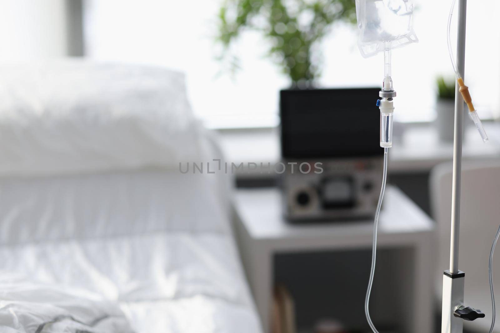 Hospital room for patient with comfortable bed and drop bottle by kuprevich