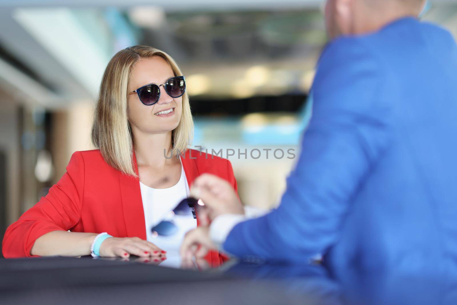 Portrait of stylish female on meeting with consultant to get advice on subject. Successful people talk about strategy. Business meeting, planning concept