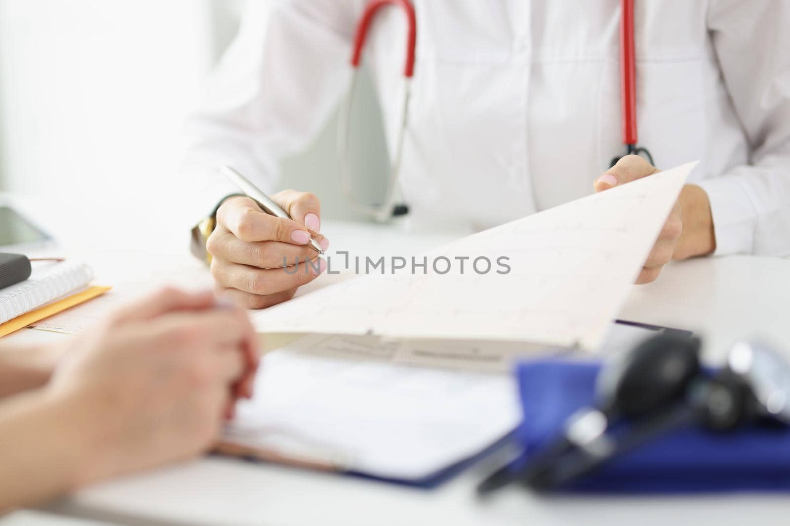 Close-up of doctor fill report in office or prescribe medication for ill patient. Qualified medical worker on shift in clinic. Medicine, save life concept