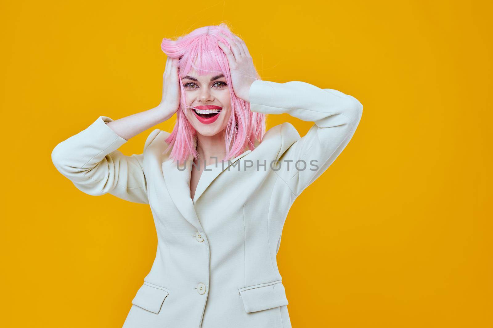cheerful woman on yellow background with pink hair glamor by SHOTPRIME