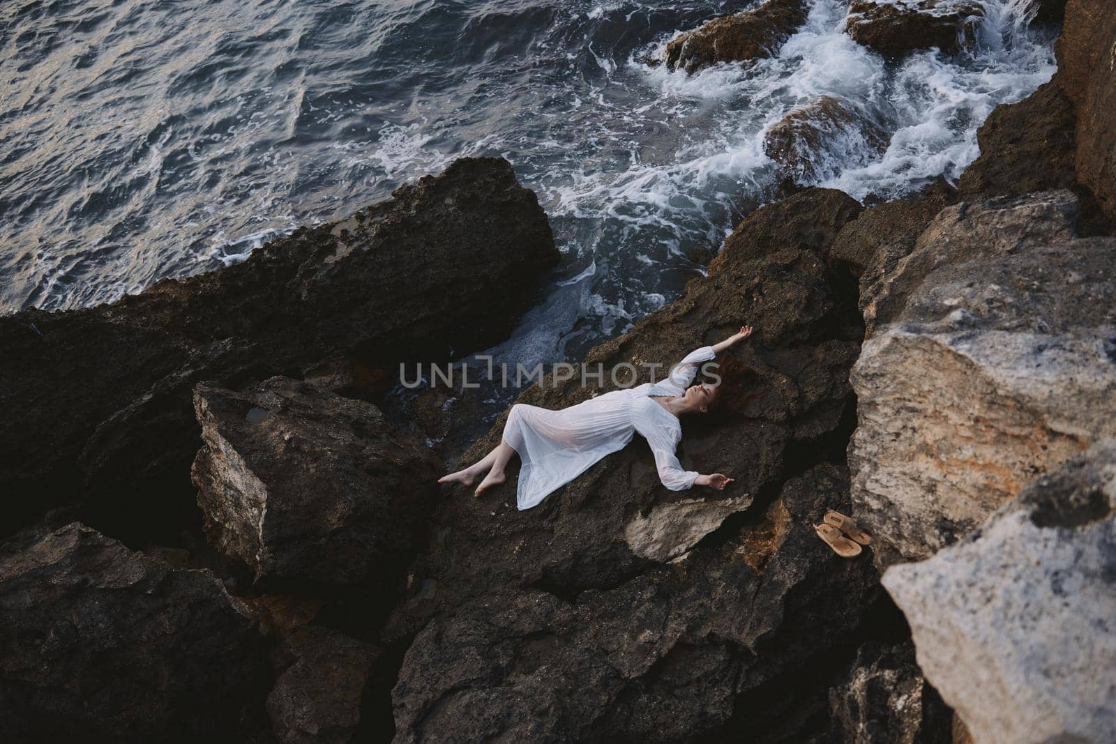 beautiful young woman in white wedding dress on sea shore wet hair landscape by SHOTPRIME