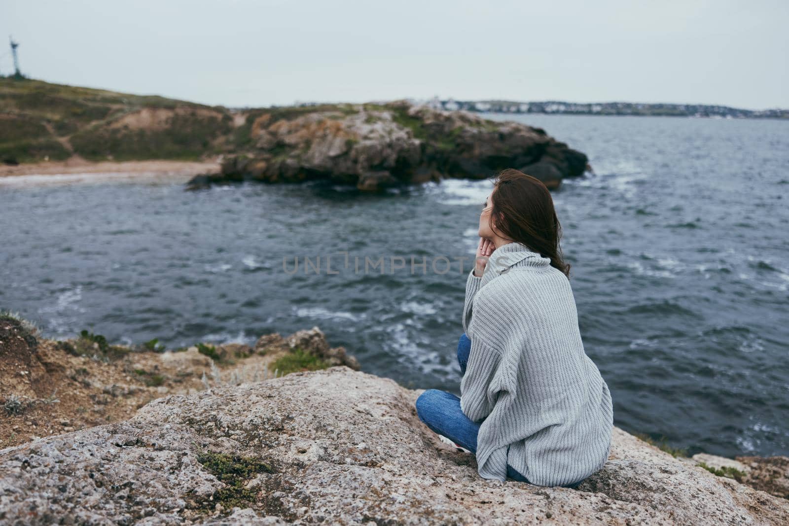 pretty woman beach tourism cloudy weather stone coast Lifestyle. High quality photo