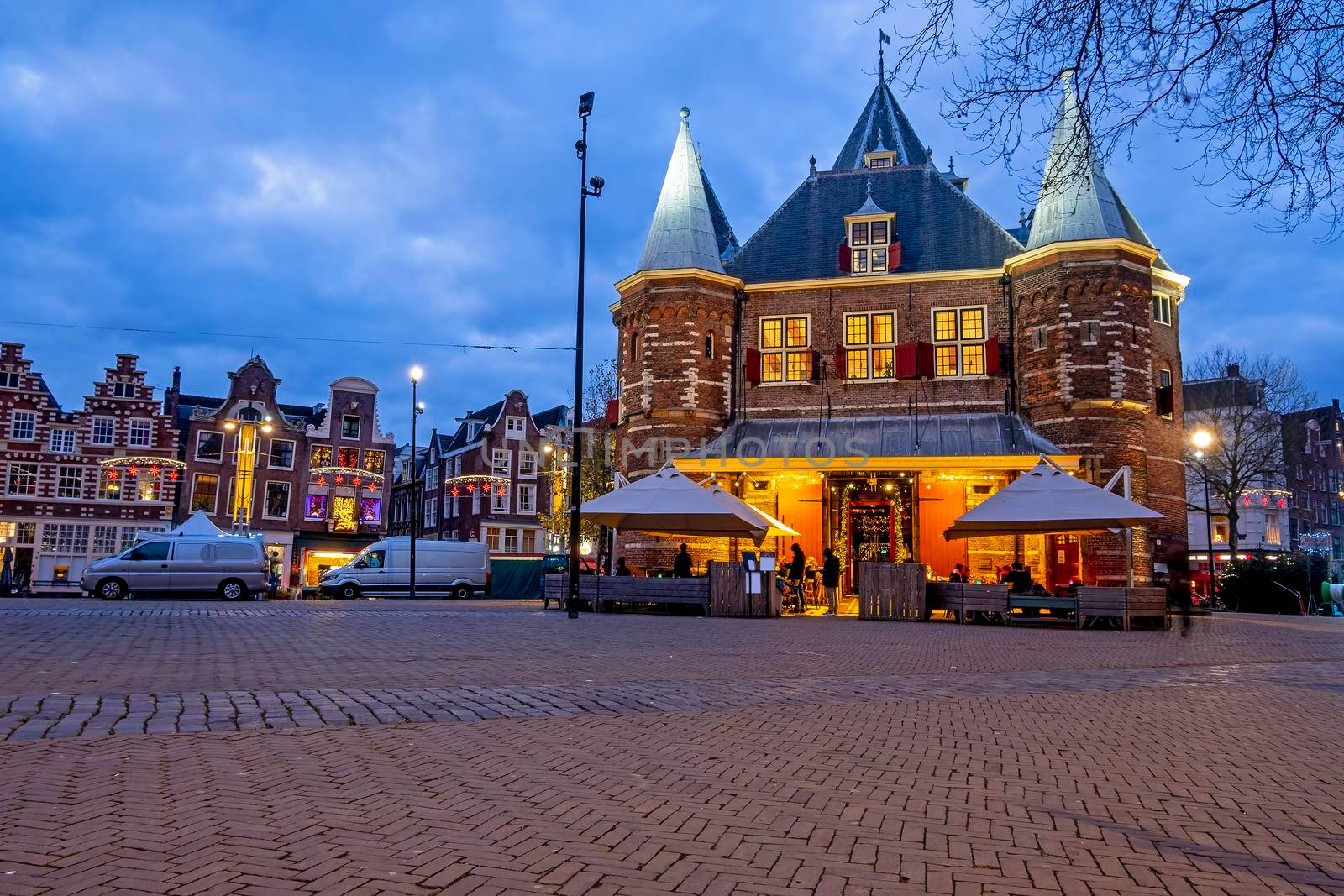 Christmas in Amsterdam at the Nieuwmarkt with the Waag building in Amsterdam at sunset by devy