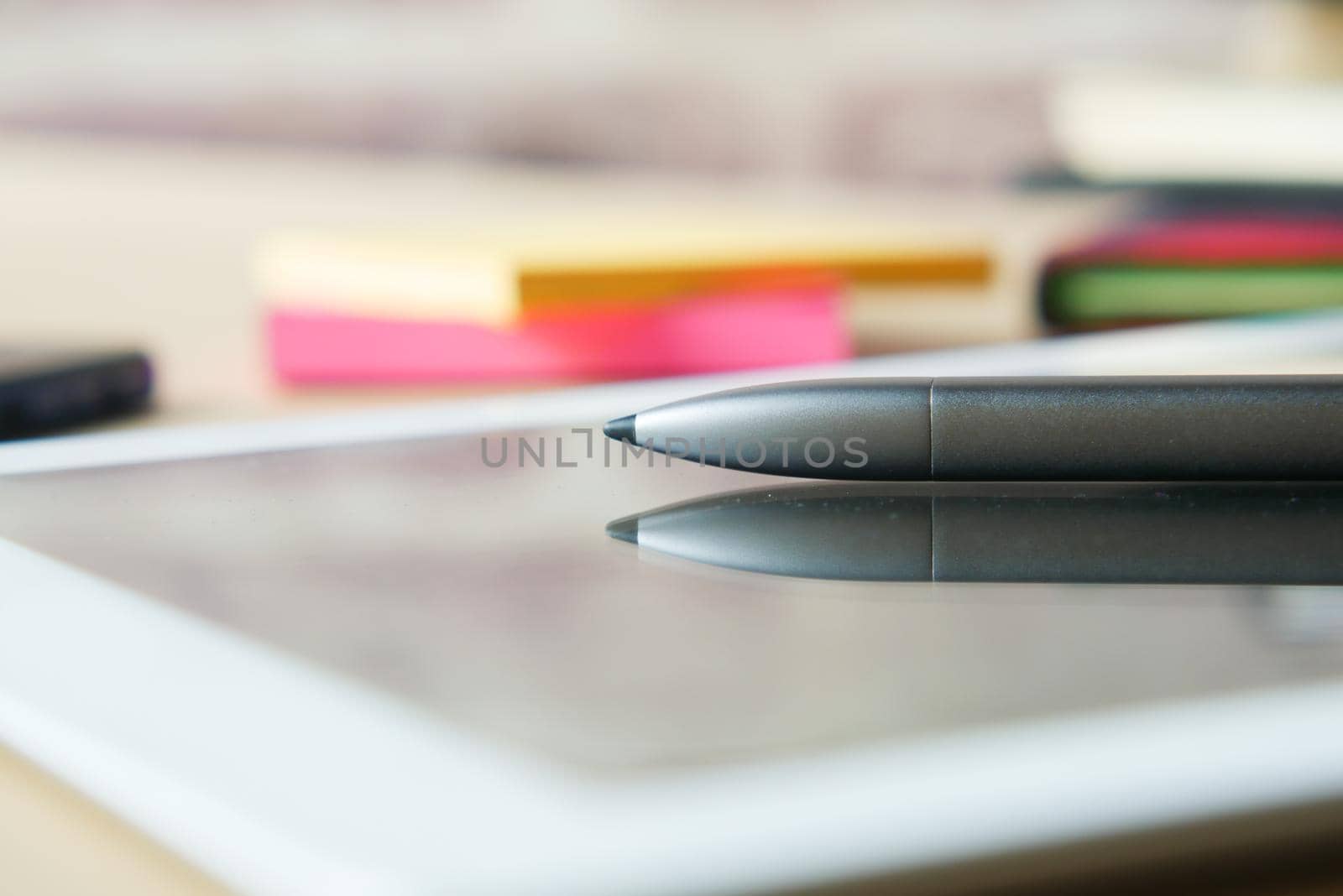 digital tablet and graphic on table .