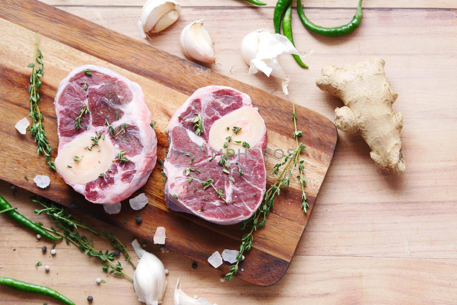 close up of raw meat on chopping board on a chopping board .