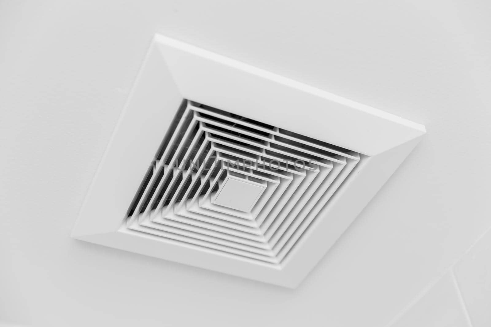 Closeup clean new Ceiling Air Duct air vent flow in office room by qualitystocks