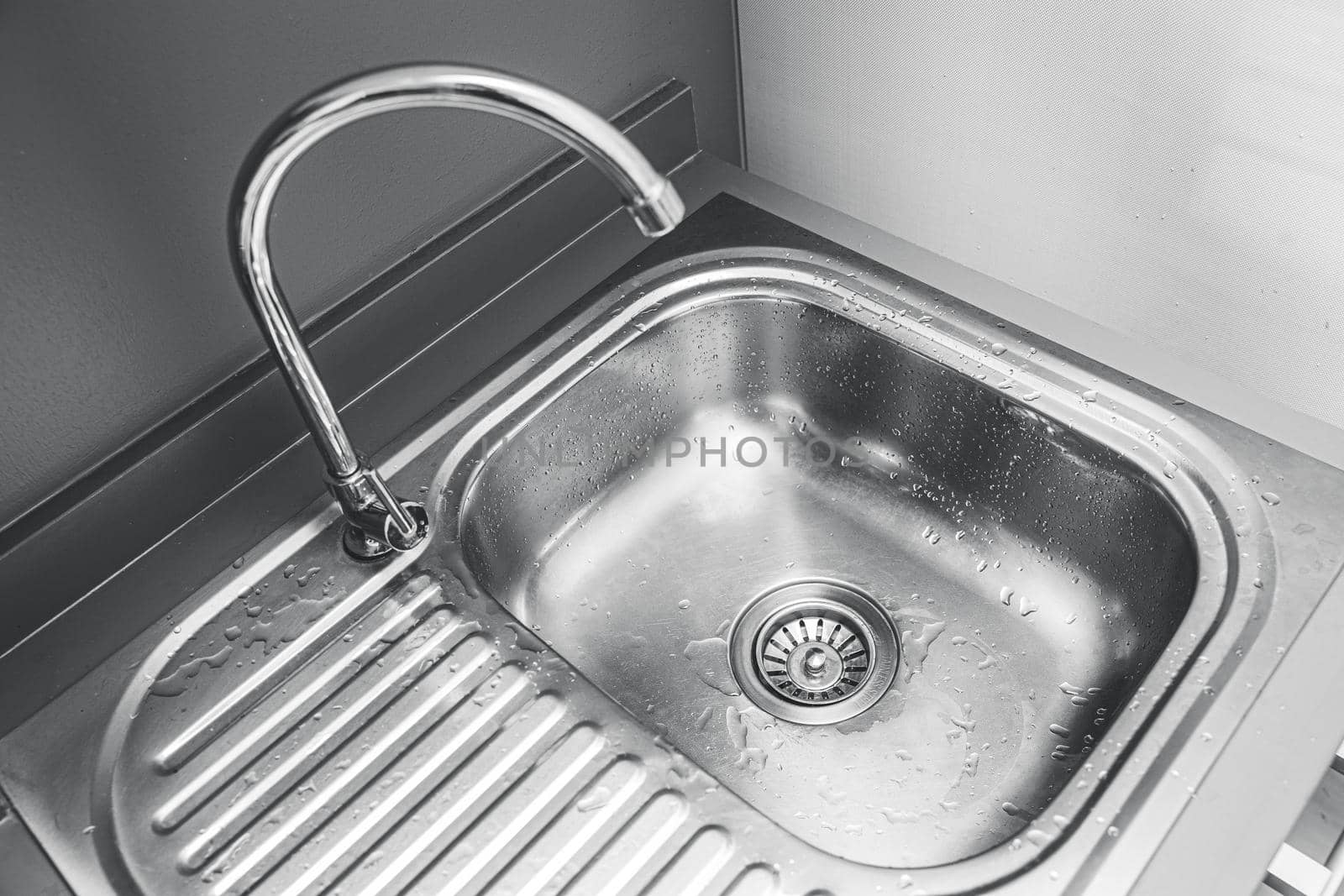 stainless steel sink basin for washing or cleaning utensil in the kitchen by qualitystocks