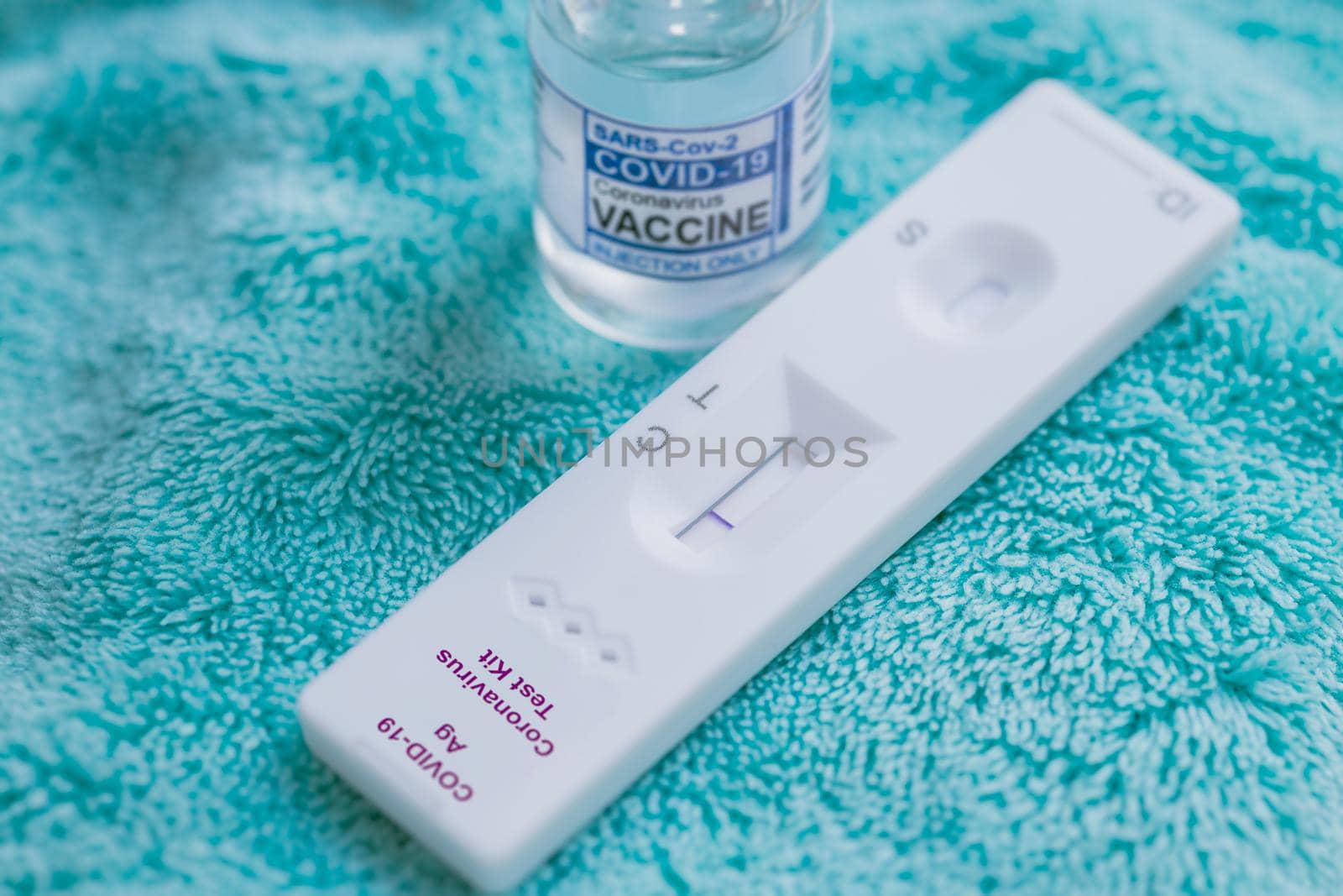 Covid-19 Self Rapid Antigen Test Kit with Covid Vaccine dose bottle for Coronavirus detect and treatment.