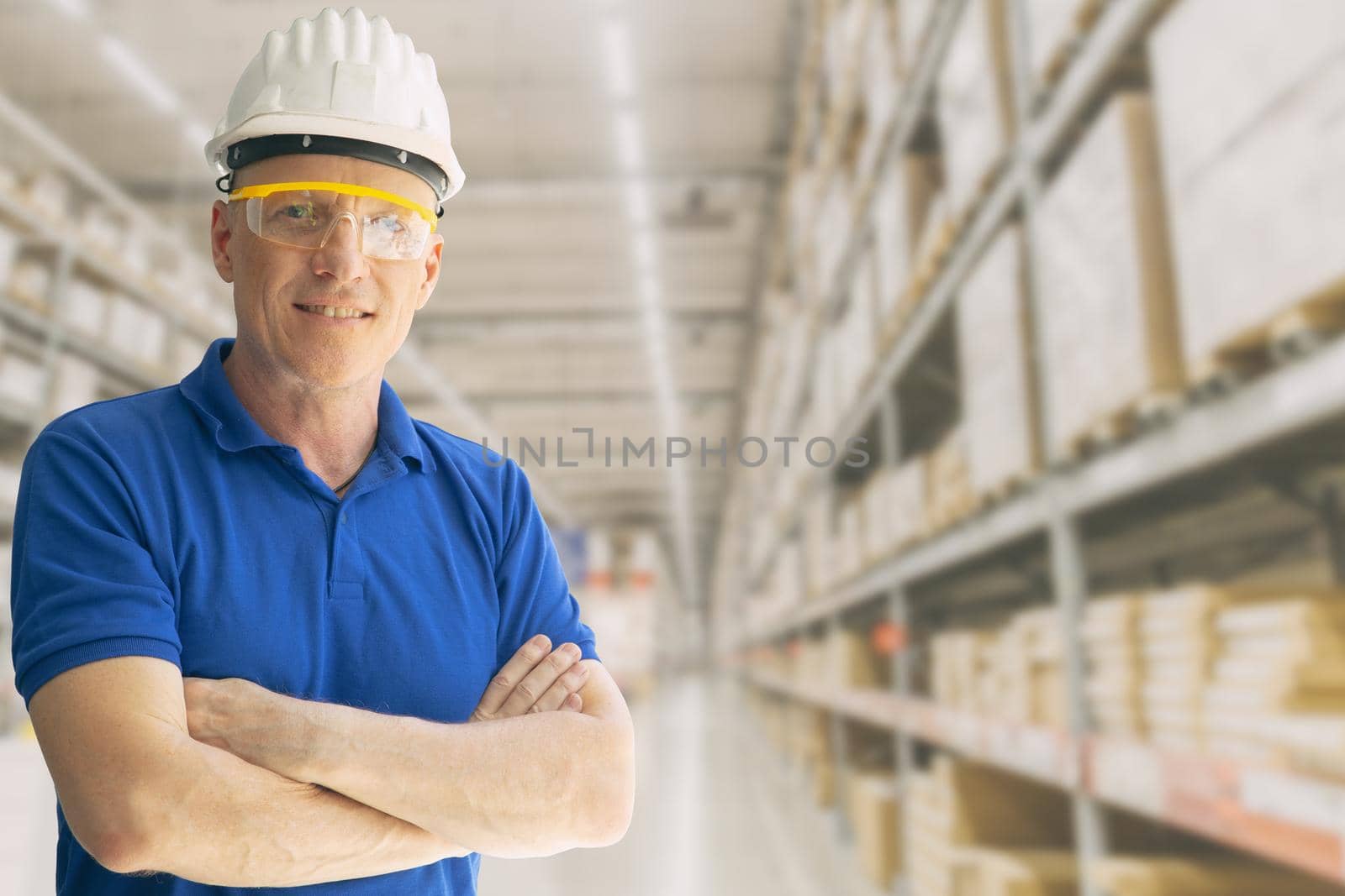 Warehouse inventory store staff worker man employee smart standing smile with space for text.