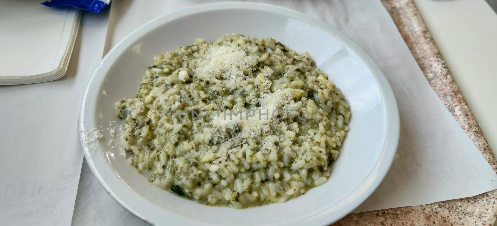 A dish of rice with turnip greens. High quality photo