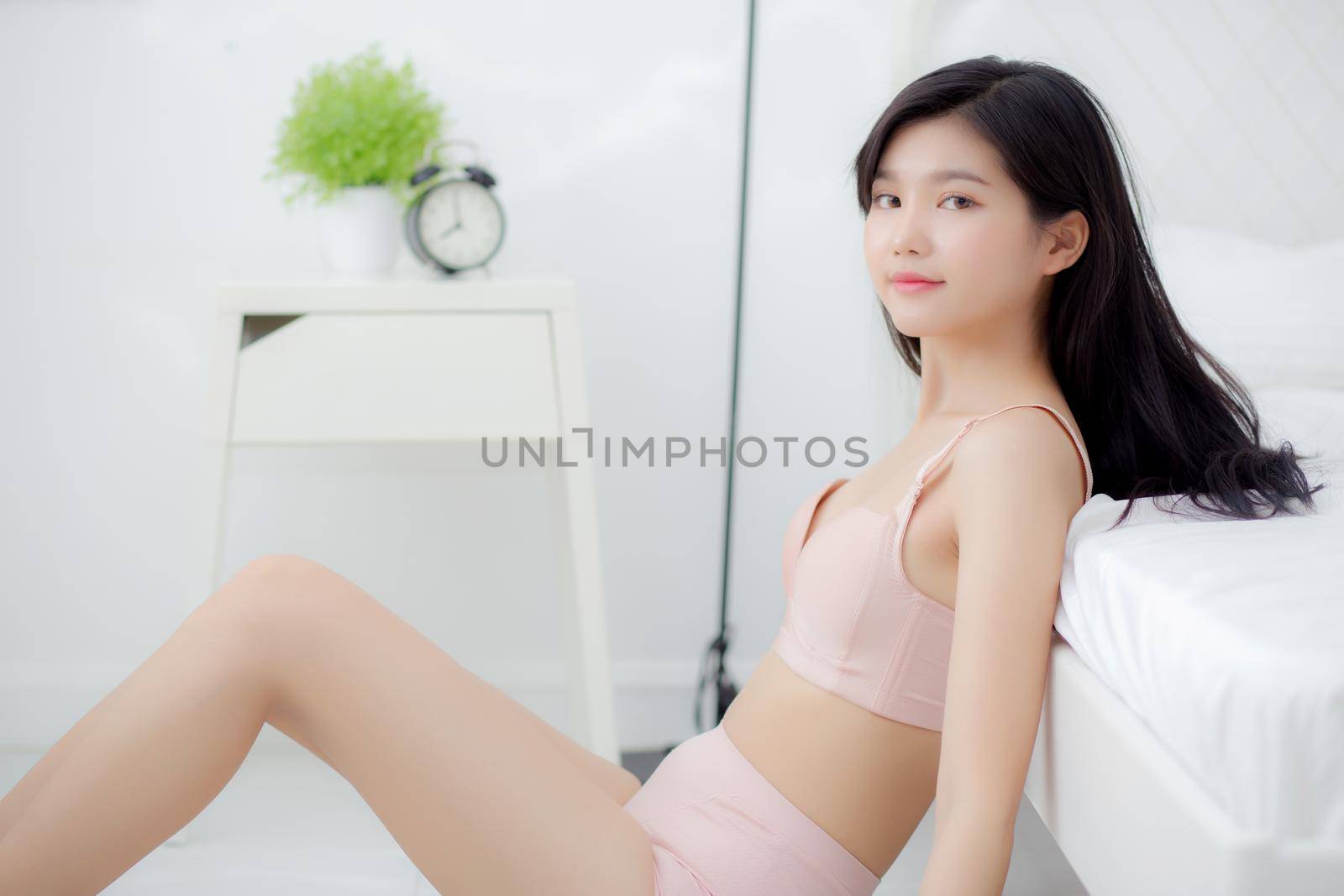 Beautiful portrait young asian woman sexy in underwear figure fit relax with seductive in bedroom, asia girl body slim in lingerie confident and happy lying on bed in bedchamber, lifestyle concept. by nnudoo