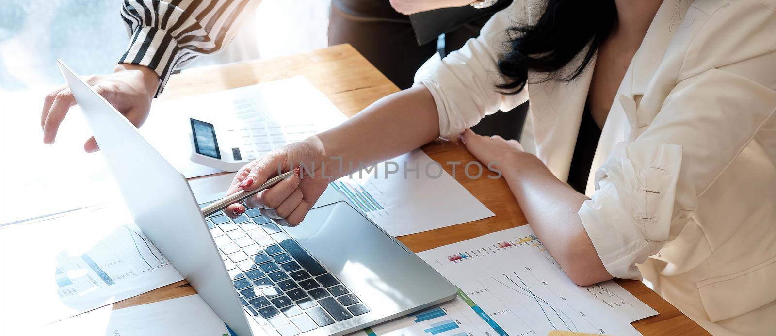 financial advisory services. Group of business advisor showing plan of investment to clients in the consultancy office by wichayada