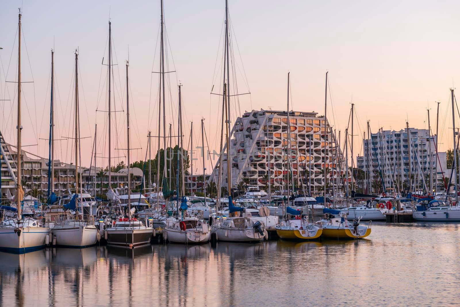 Sunrise over the pyramids of the seaside resort of La Grande Motte, in Hérault in Occitanie, France by Frederic