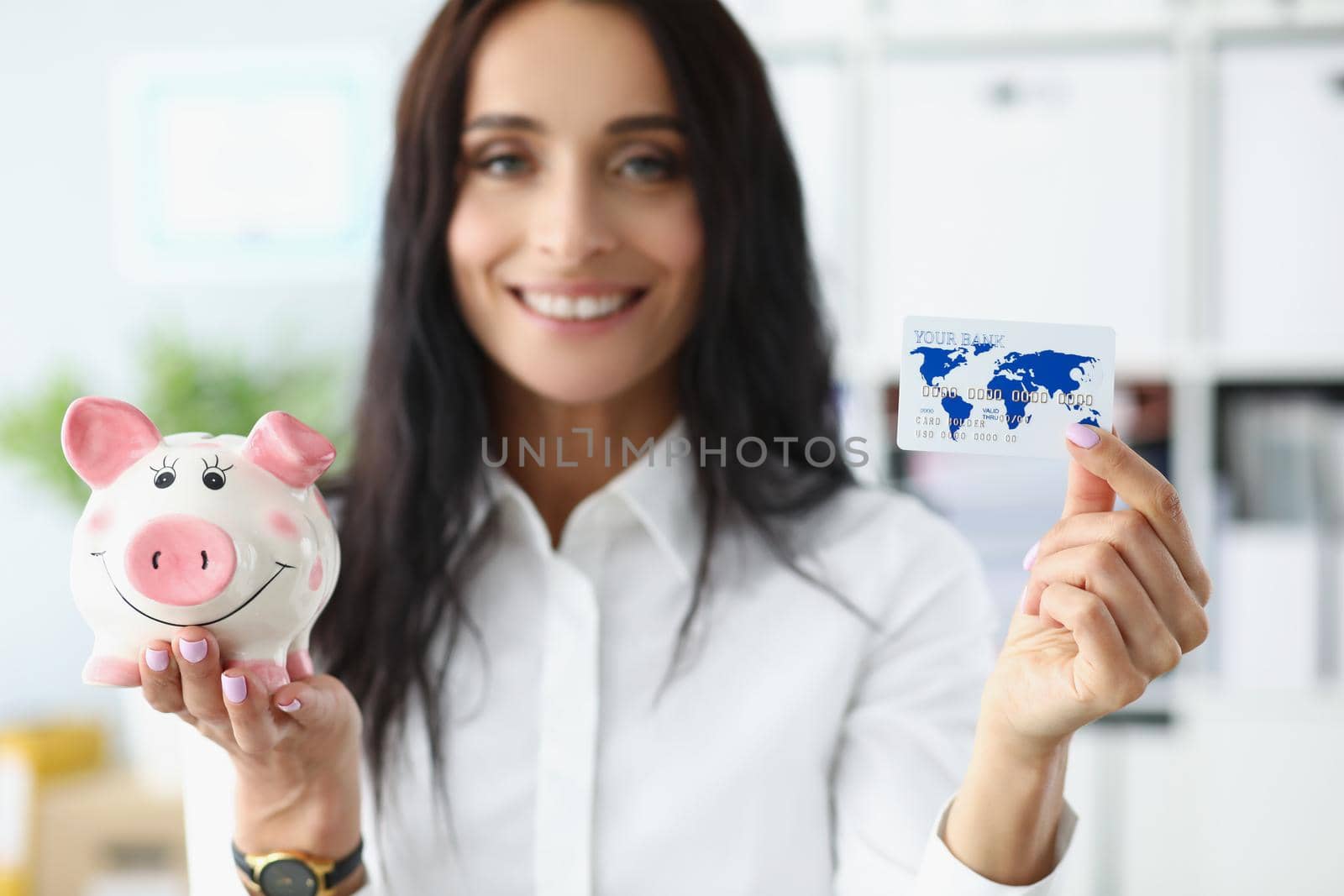 Portrait of woman hold piggybank money container in one hand and credit card in another. Best options for saving up for future. Finance, investment concept
