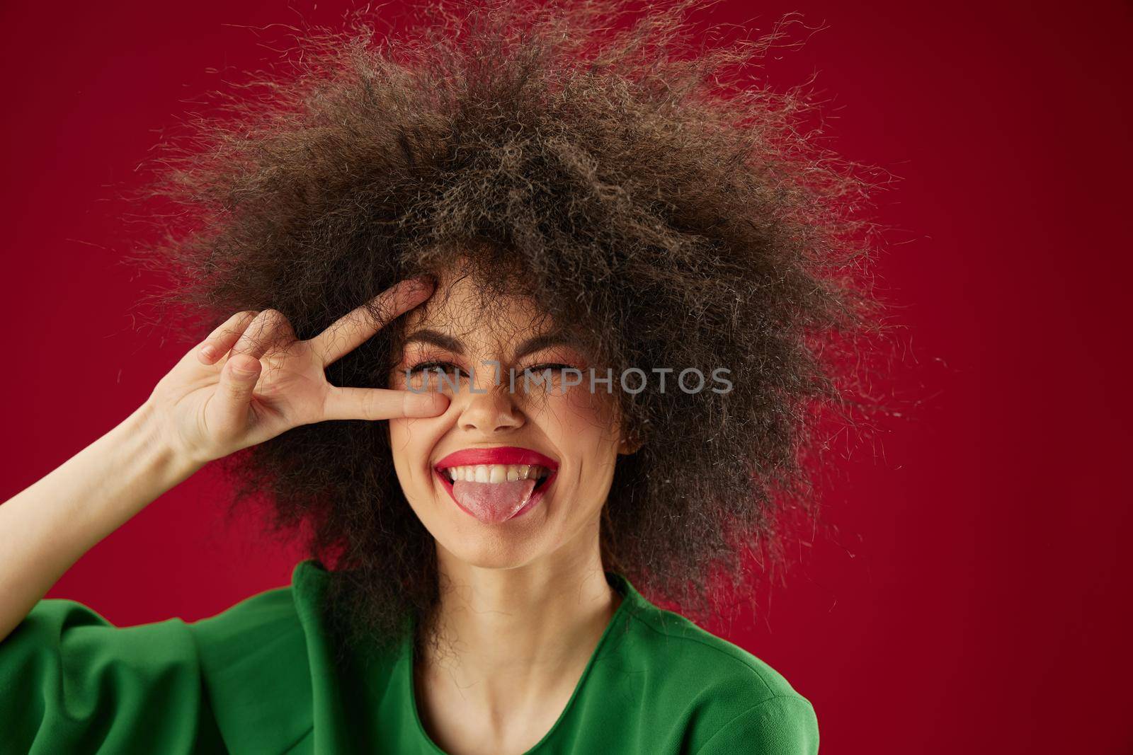 Beauty Fashion woman Afro hairstyle green dress emotions close-up color background unaltered by SHOTPRIME