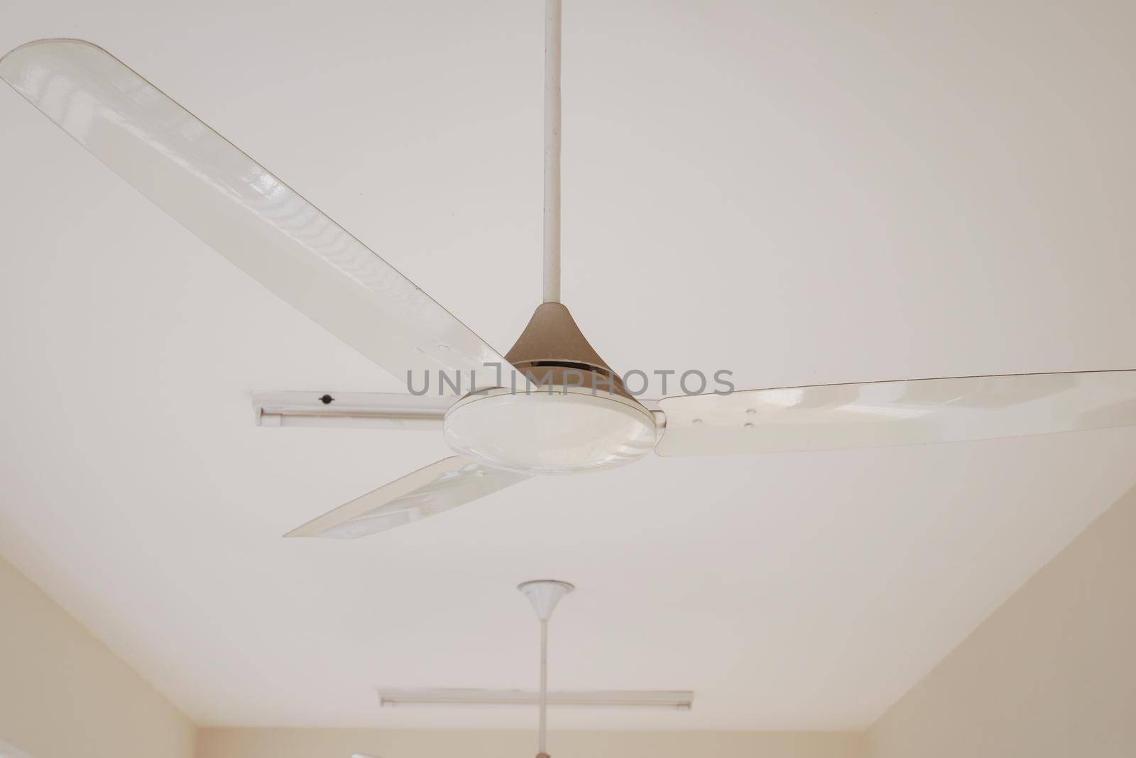 Rotation of ceiling fan close up ,