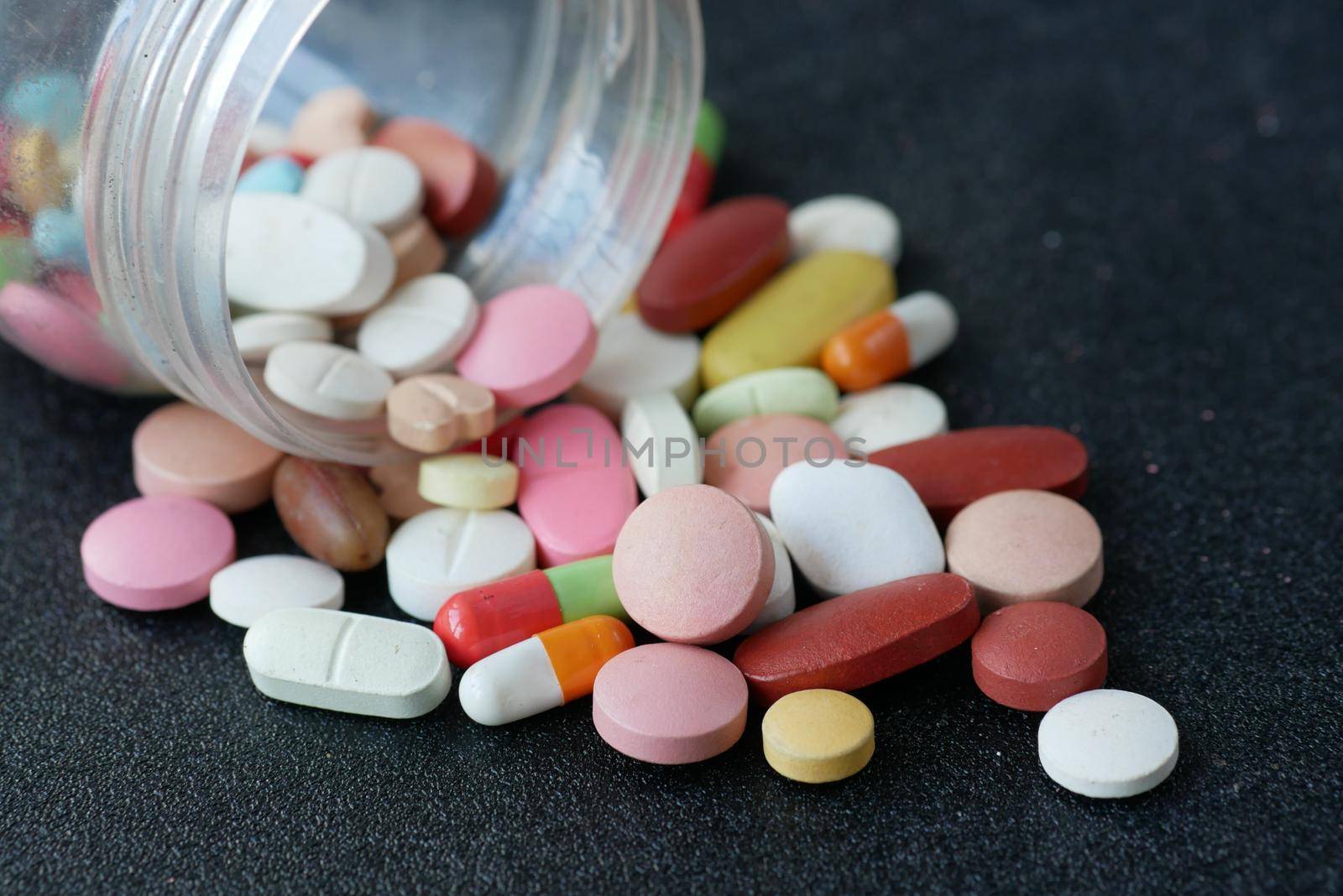 selective focus. Close up of many colorful pills and capsules .