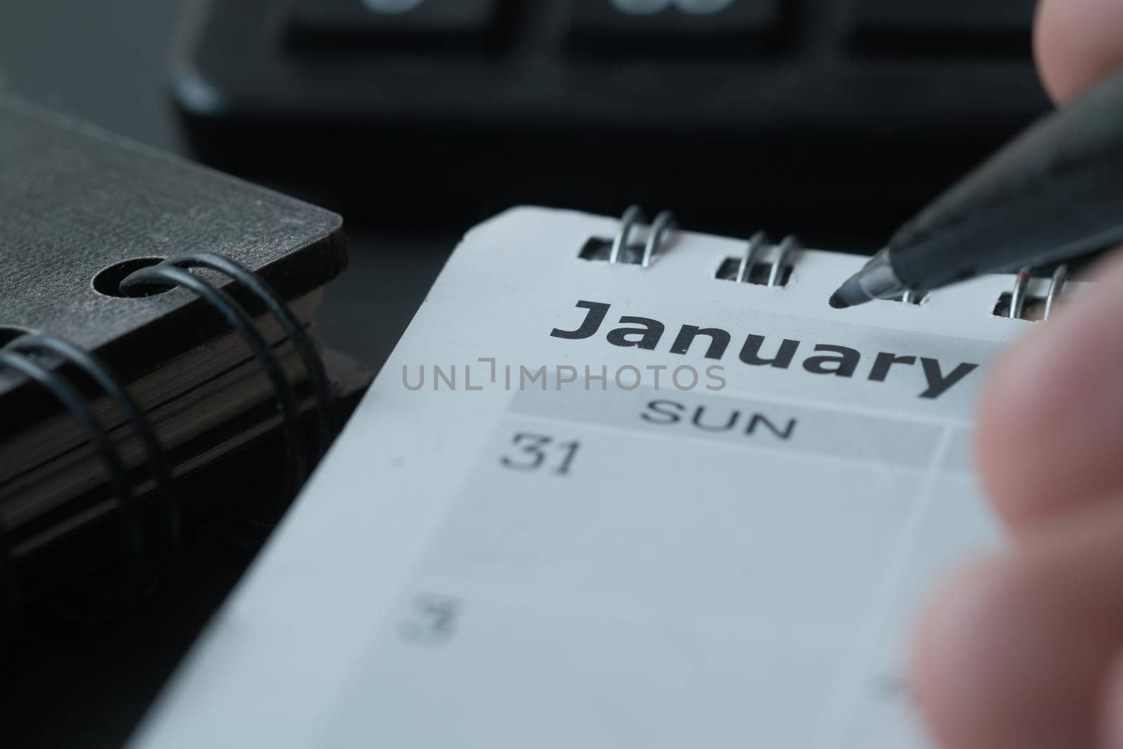 January month on calendar on office desk.