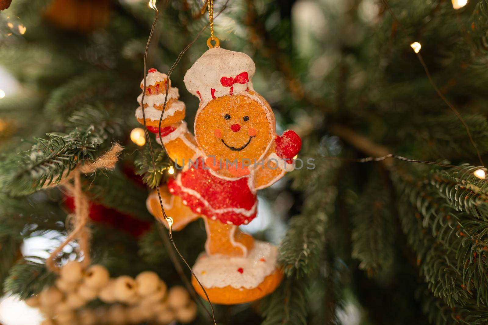 Beautiful Christmas tree decorated with gingerbread, dried oranges and cinnamon. Merry Christmas and New Year holidays background.