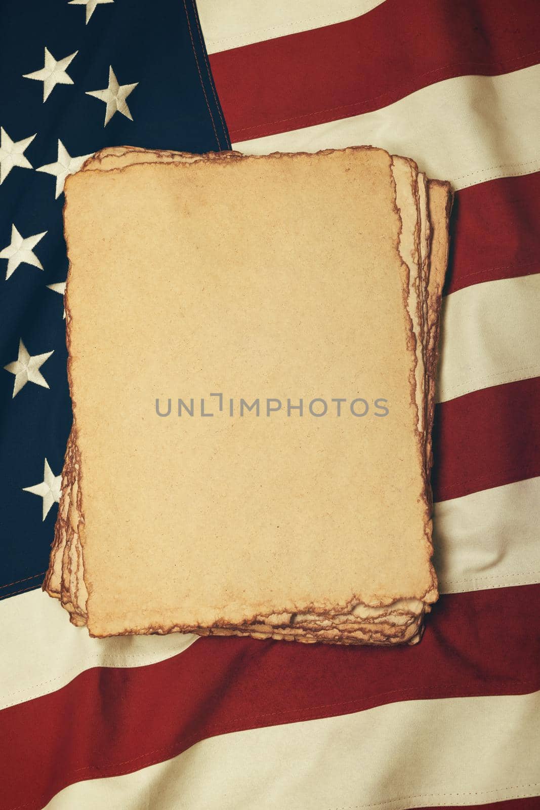 Vintage paper on old US American flag by BreakingTheWalls