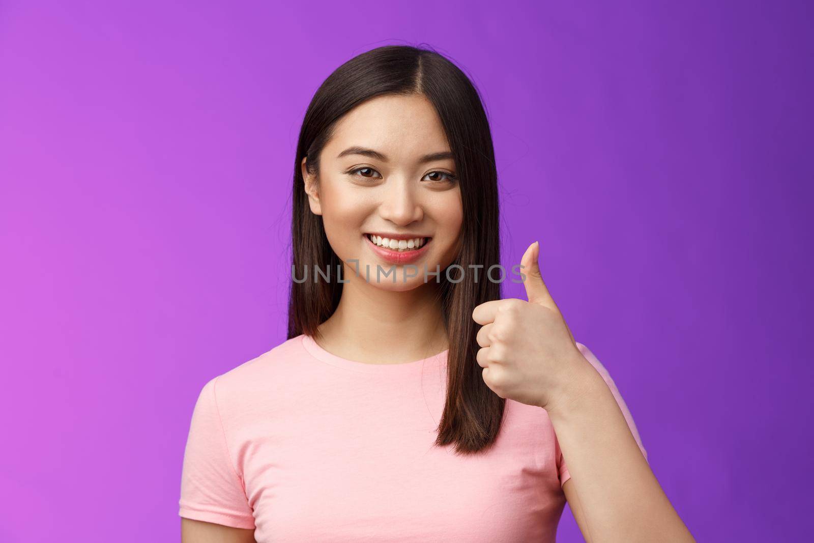 Friendly good-looking supportive asian female friend encourage you keep going, nice work, satisfied good job, smiling approval, show thumb-up gesture, grinning accepting perfect choice by Benzoix