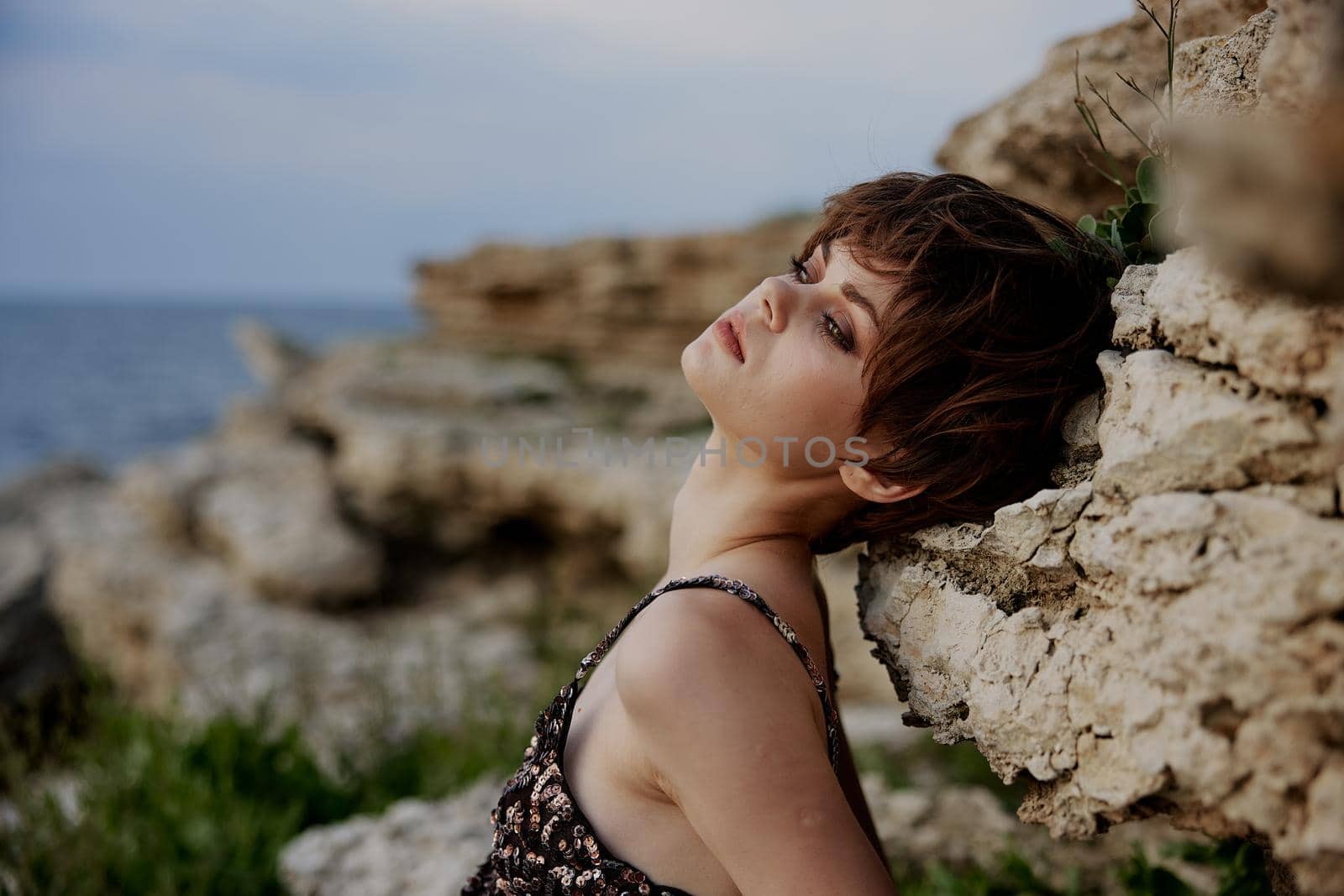 woman with makeup in dress on nature rocks landscape Lifestyle unaltered by SHOTPRIME