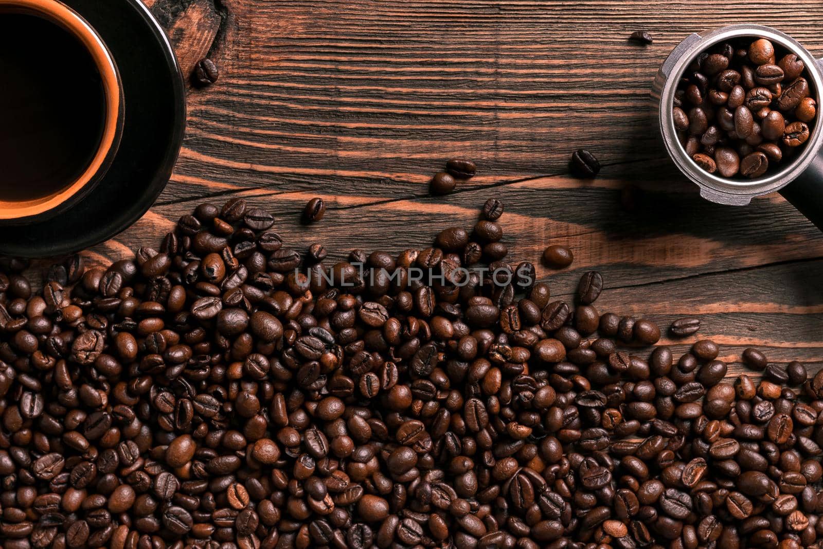 Coffee cup and beans frame on wooden table. Top view. Copy space. Still life. Mock-up. Flat lay