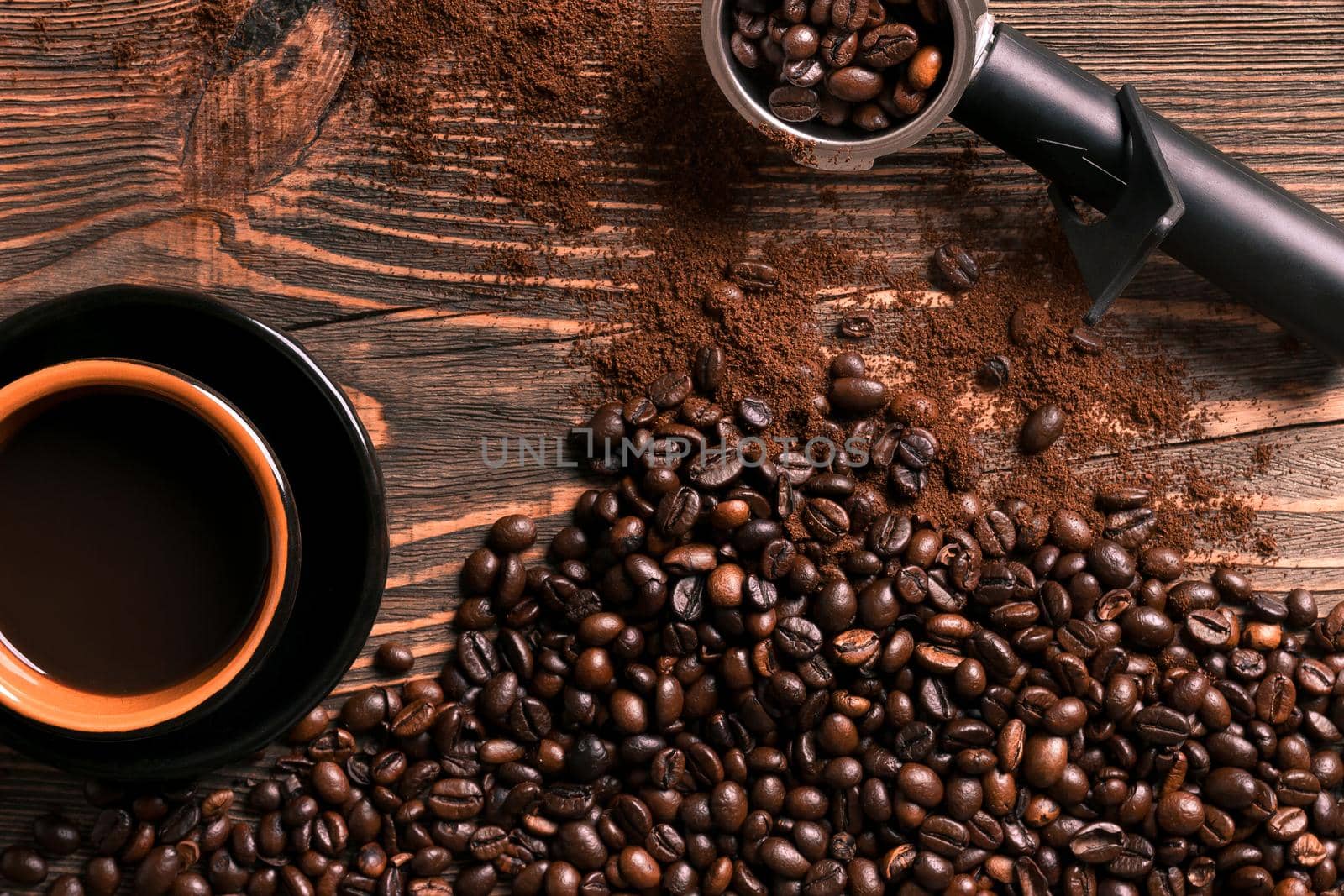 Coffee cup and beans frame on wooden table. Top view. Copy space. Still life. Mock-up. Flat lay