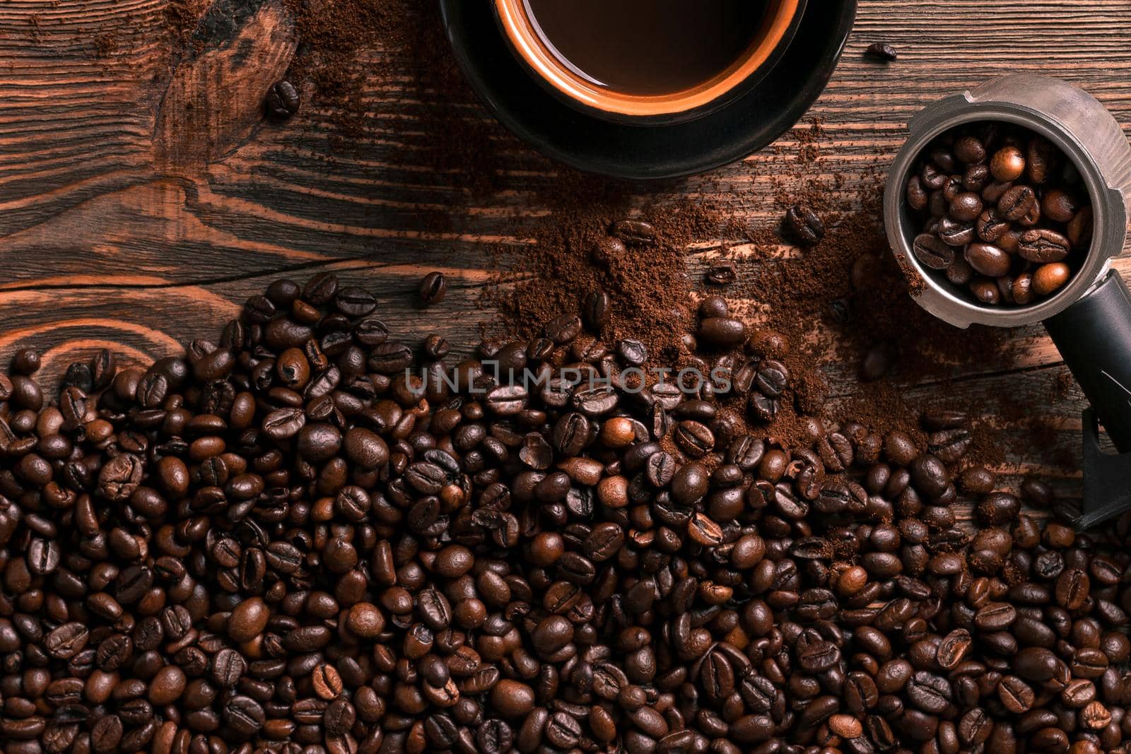 Coffee cup and beans frame on wooden table. Top view. Copy space. Still life. Mock-up. Flat lay