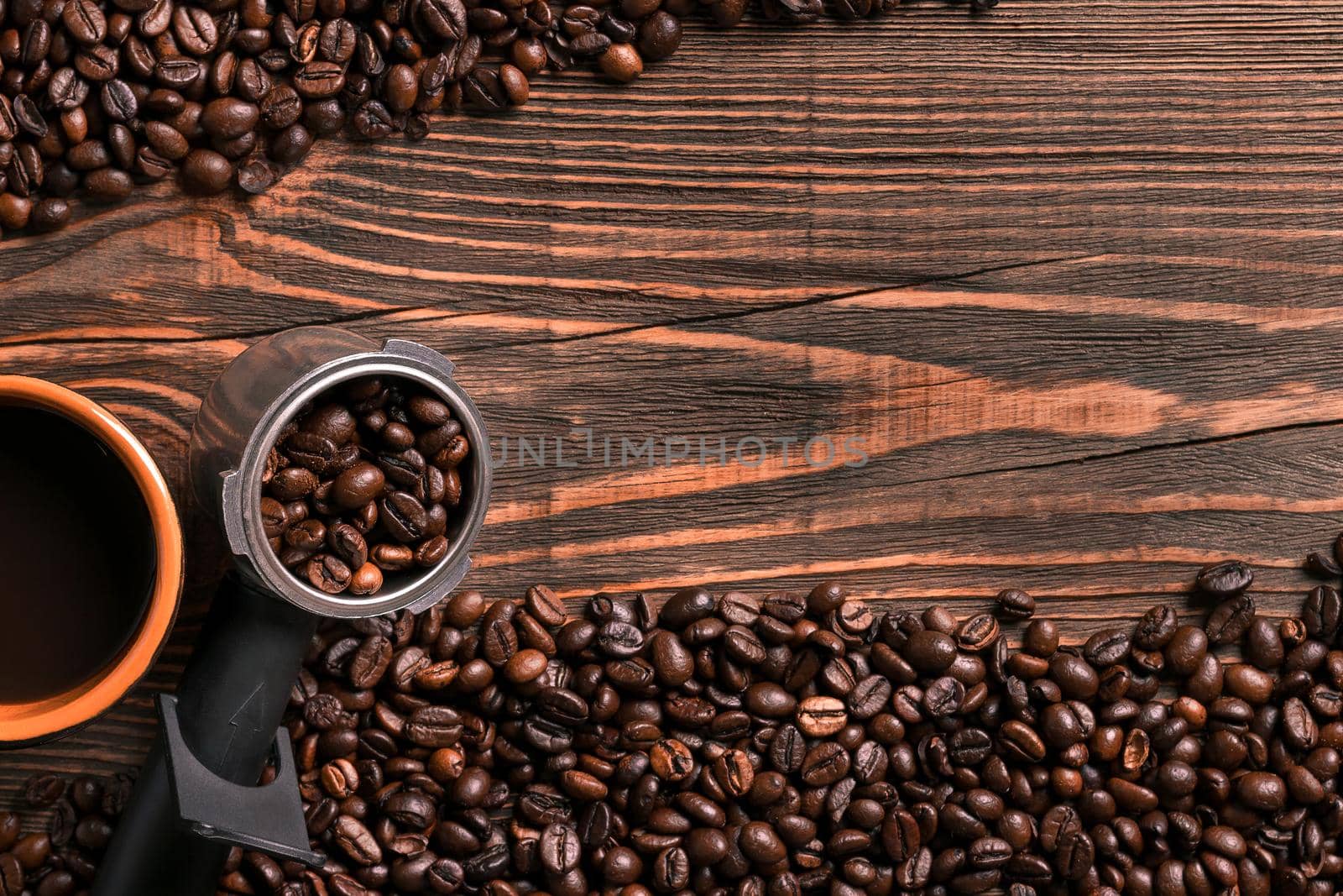 Coffee cup and beans frame on wooden table. Top view. Copy space. Still life. Mock-up. Flat lay