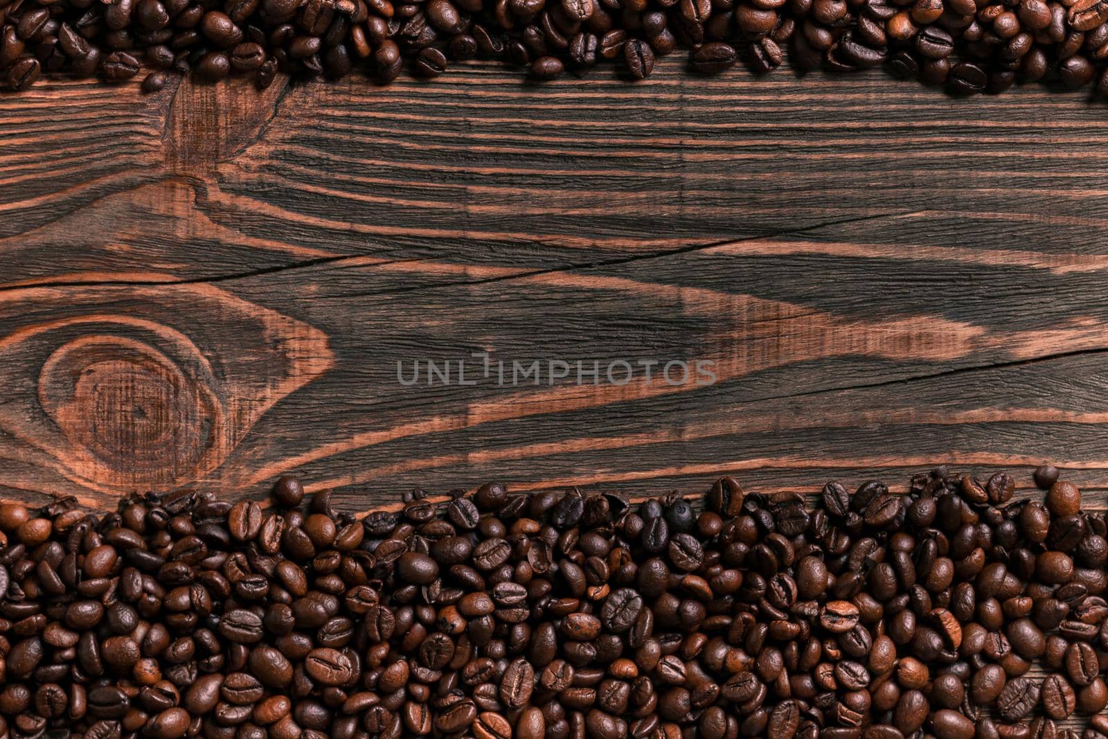 Coffee beans on wooden table texture with copy space. View from by nazarovsergey