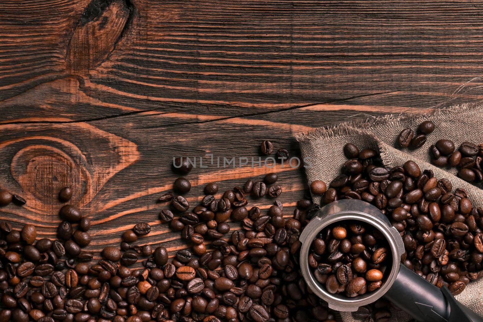 Coffee beans on wooden table texture with copy space. View from above. Still life. Flat lay. Mock-up