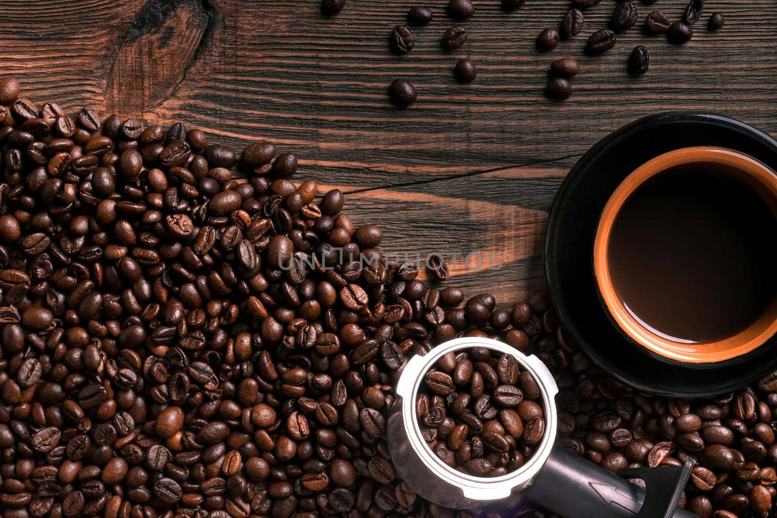 Coffee cup and beans frame on wooden table. Top view. Copy space. Still life. Mock-up. Flat lay