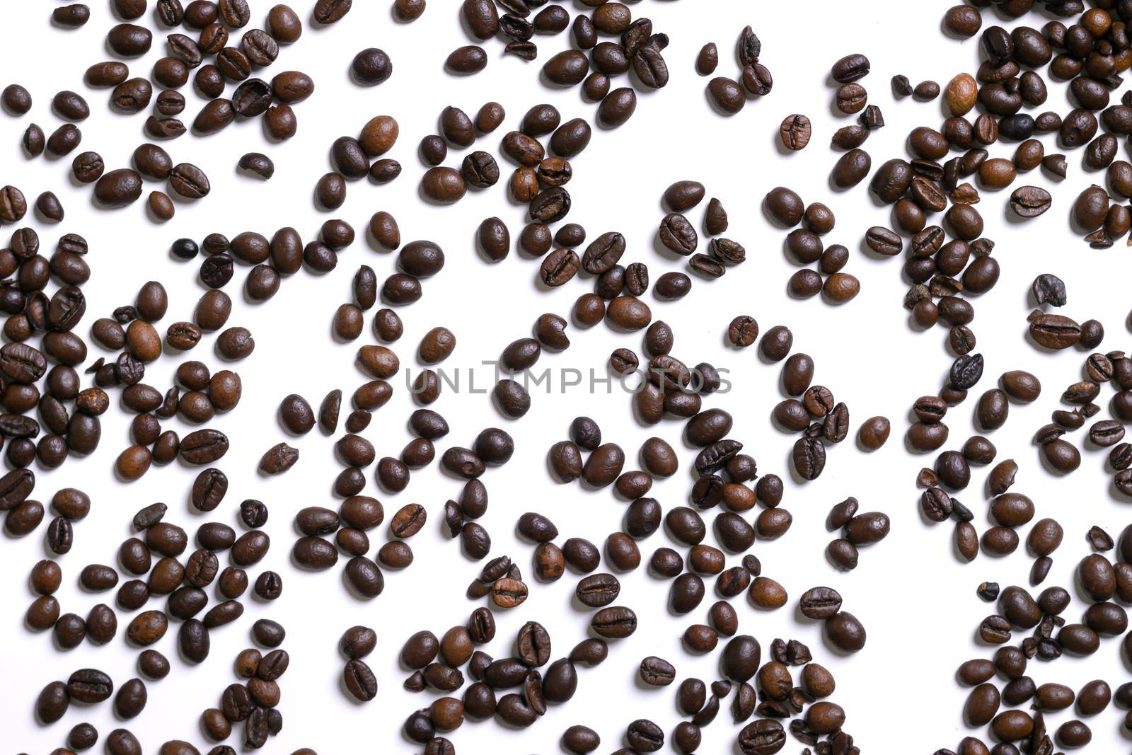 White background with coffee beans. Top view. Still life. Copy space. Flat lay.